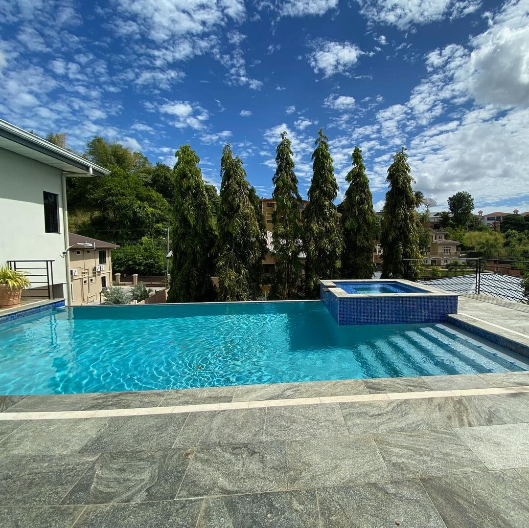 Luxury pool home with blue sky